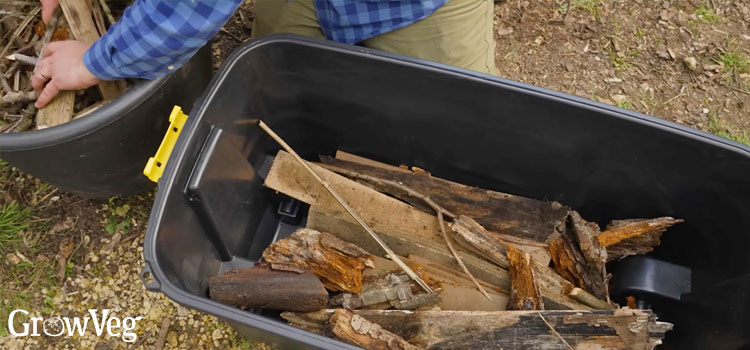 Filing a storage box with woody material
